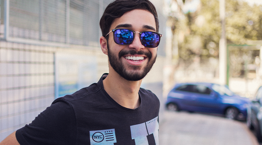 Smile More — It’s Good For You!, image of a man wearing sunglasses and smiling