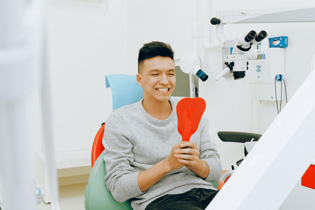 dental insurance, I Need a Dental Appointment, But What Does Dental Insurance Cover?, image of a man sitting on dental chair in scripps ranch, san diego