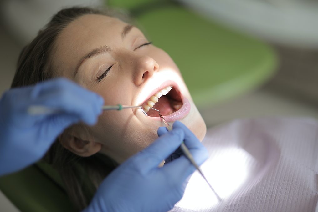 Understanding Dental Crowns And If You Might Need One, image of a woman getting a dental crown.