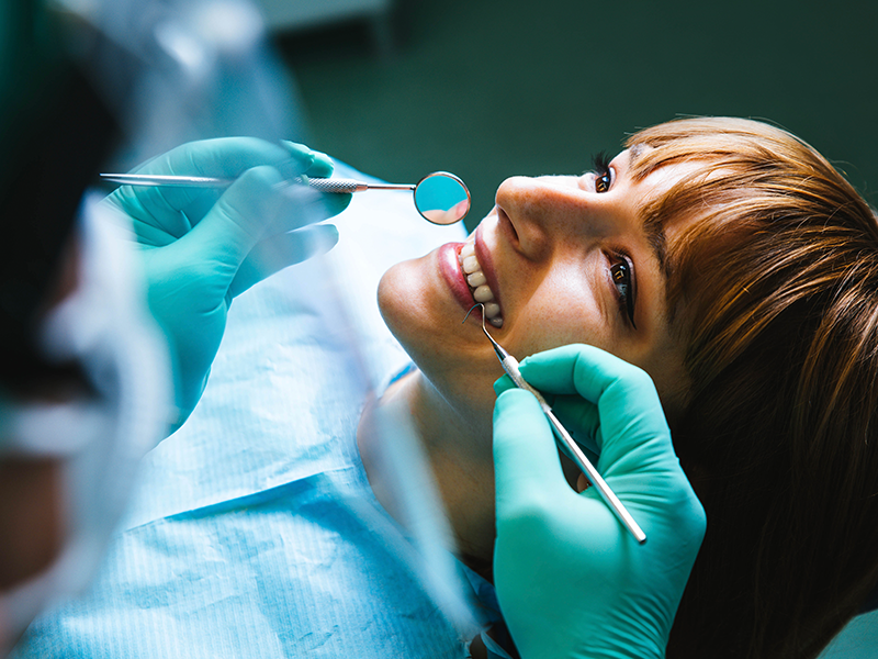 dental services,Oral Surgery, image of a woman at the dentist preparing for oral surgery