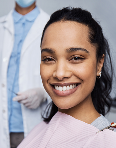 affordable dentist, mira mesa, scripps ranch. Image of a woman smiling at the dentist.